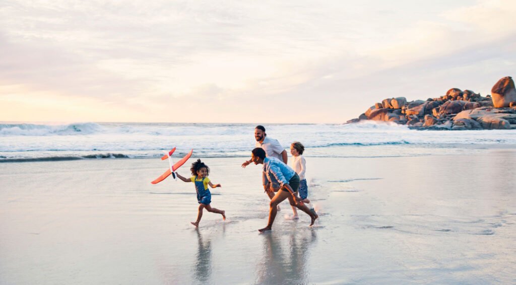Family playing, having fun at the beach